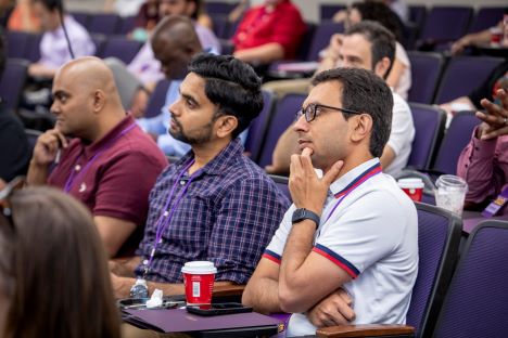 three faculty members listening during 2023 New Faculty Summit