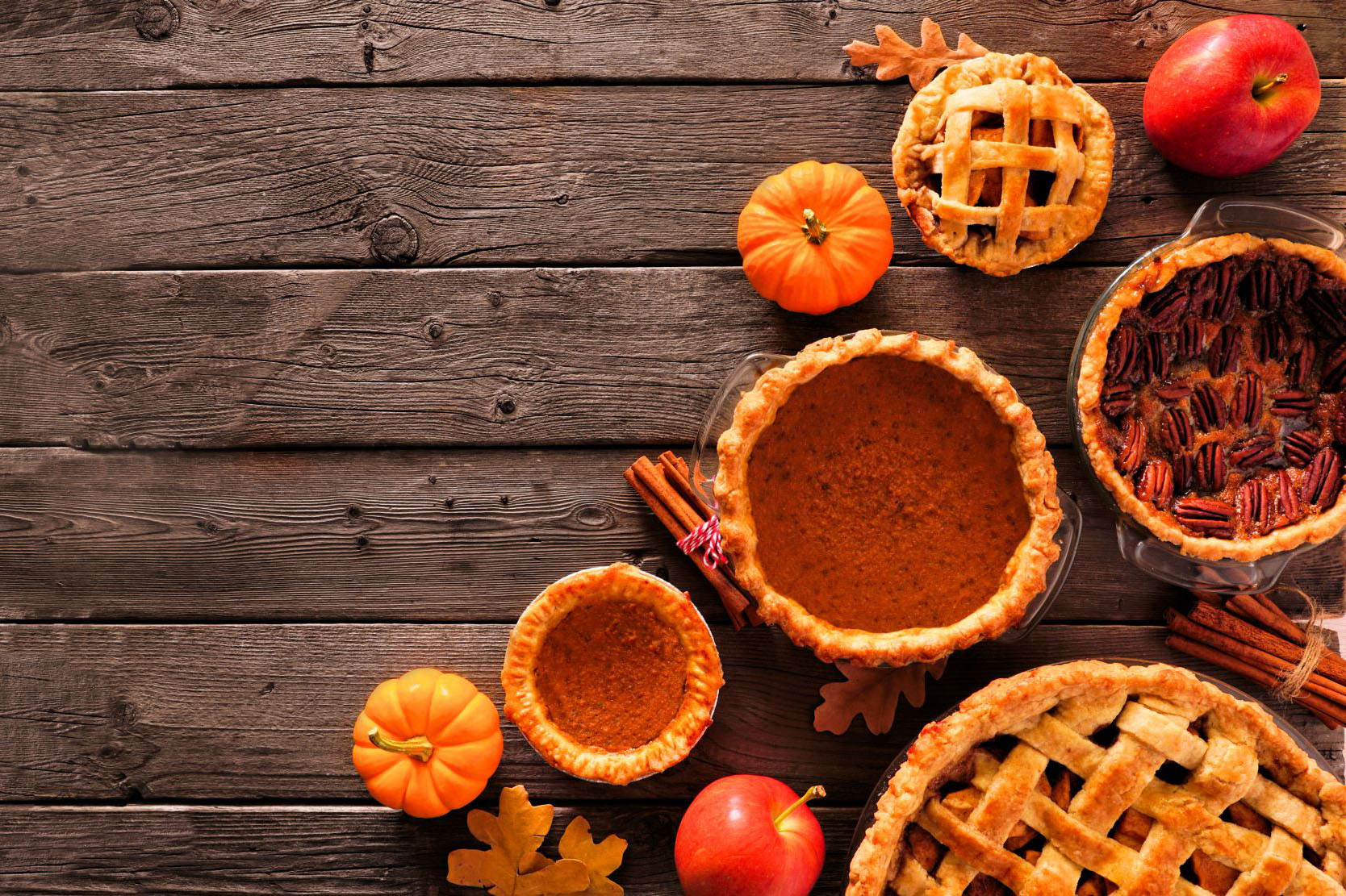 Various Thanksgiving foods on wooden table top