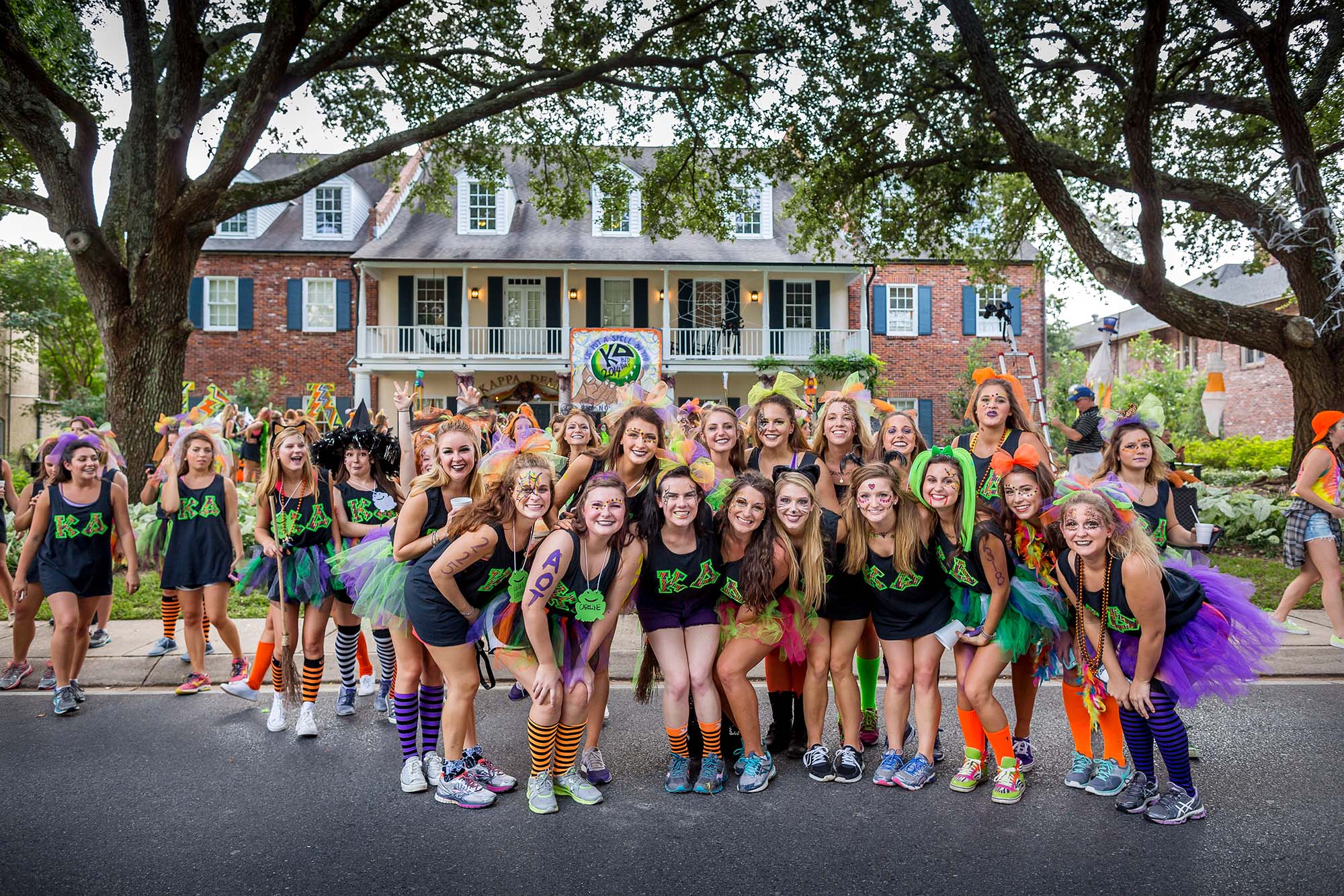 members in front of house